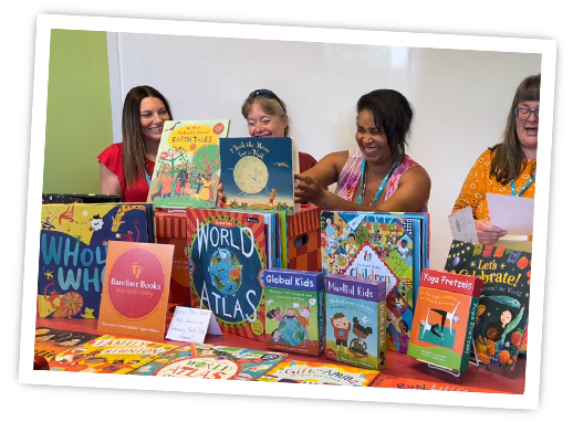 Community Booksellers holding up Barefoot books