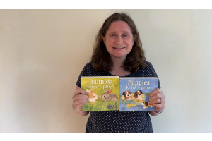 Author Razeena Laura Gehl holding up her books, Bunnies Know & Grow and Puppies Know & Grow