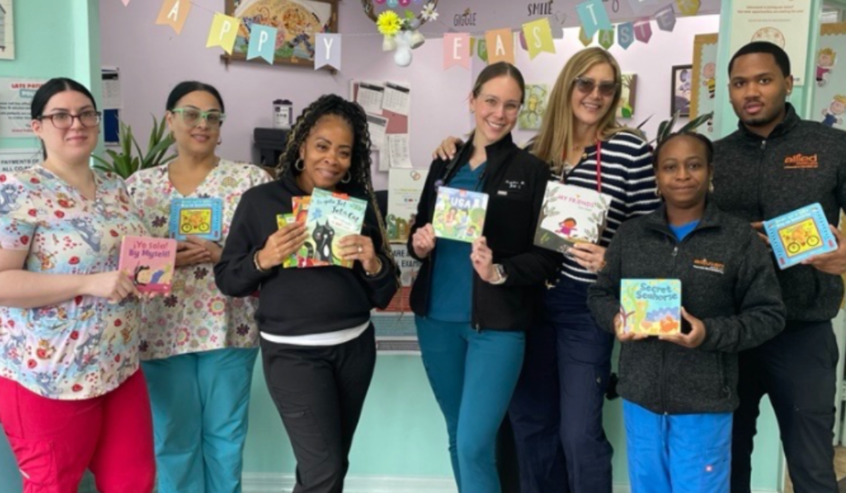 ROR team members holding up copies of Barefoot books